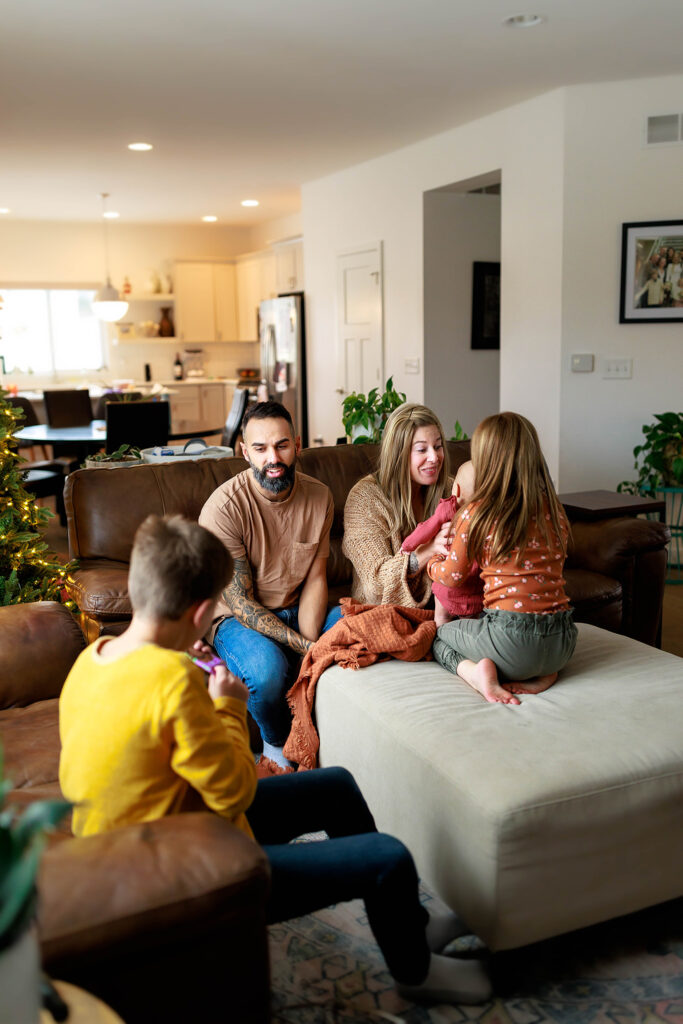 pullback image of family in living room during lifestyle session in home