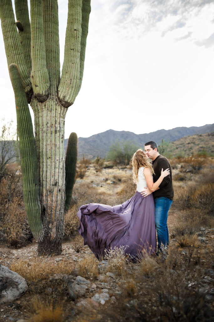 couple kissing in the desert