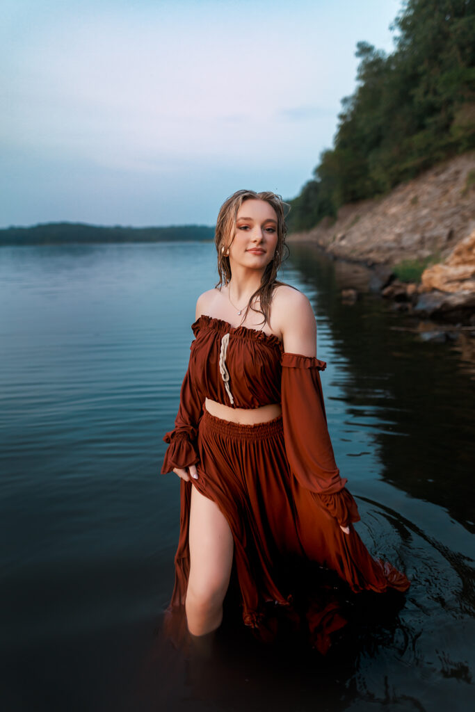 senior pictures during blue hour at the lake in iowa city