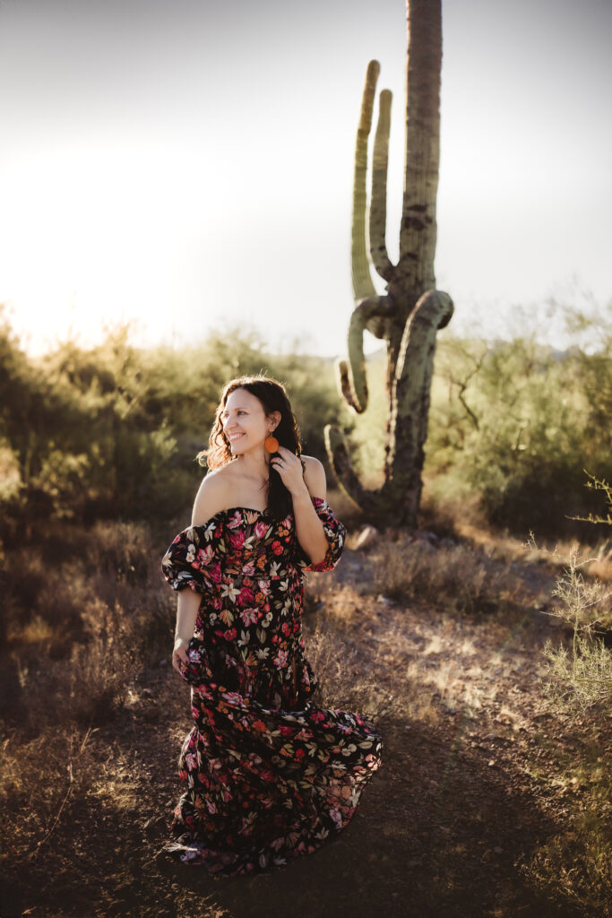 woman in the desert wearing floral gown