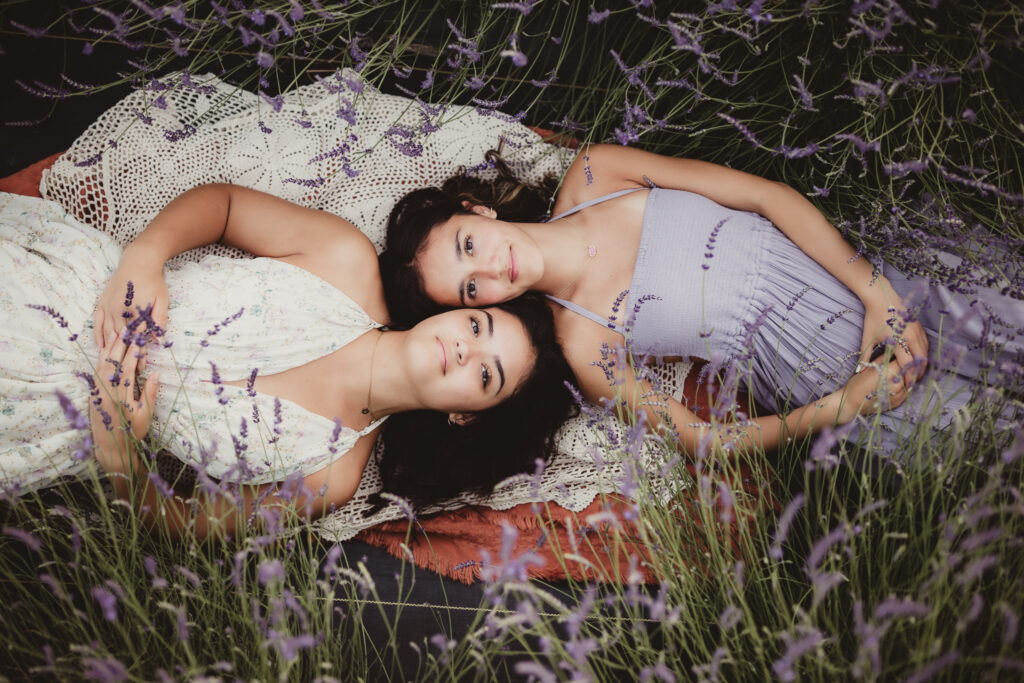 sisters laying in lavender field